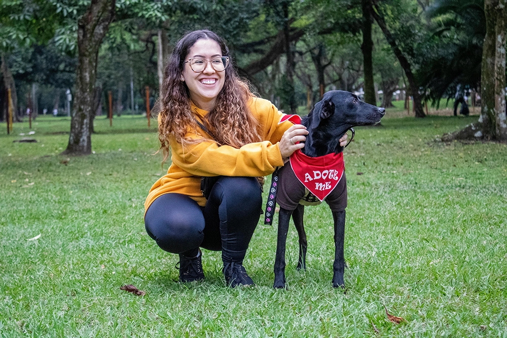 girl helping a dog to get adopted in UAE